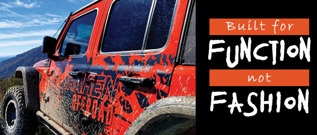 Orange and Black Jeep Wrangler on a Rocky Mountain Trail